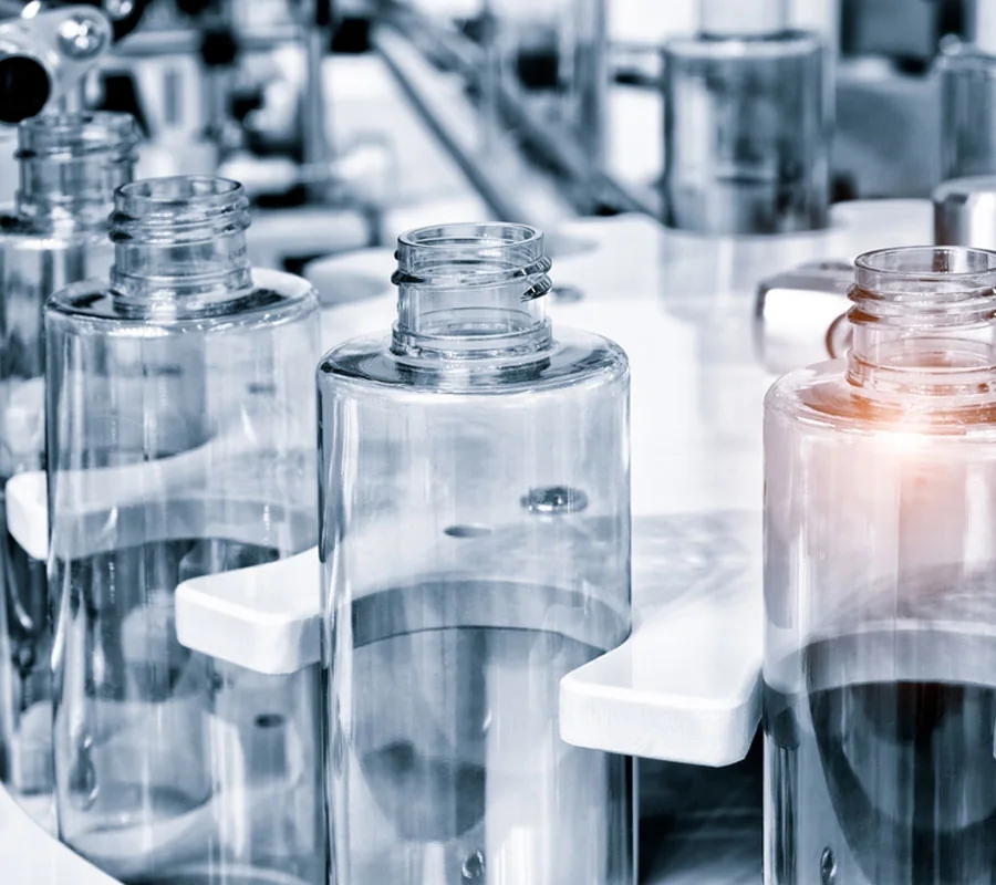 Clear bottles on the filling line
